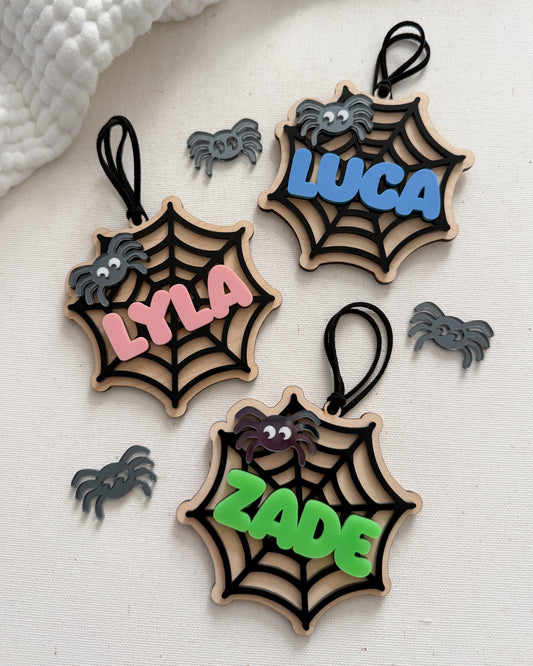Three wooden spider web ornaments with names 'LYLA', 'LUCA', and 'ZADE' on a white background.