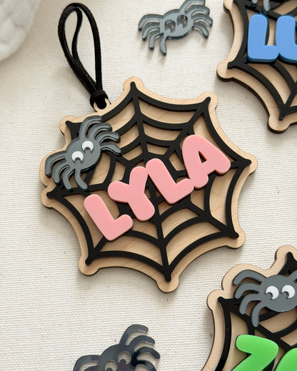 Decorative Halloween ornament with spider webs and spiders on a light background