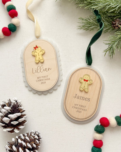 Two wooden Christmas tags with engraved names and a gingerbread man design, surrounded by festive decorations on a white background.